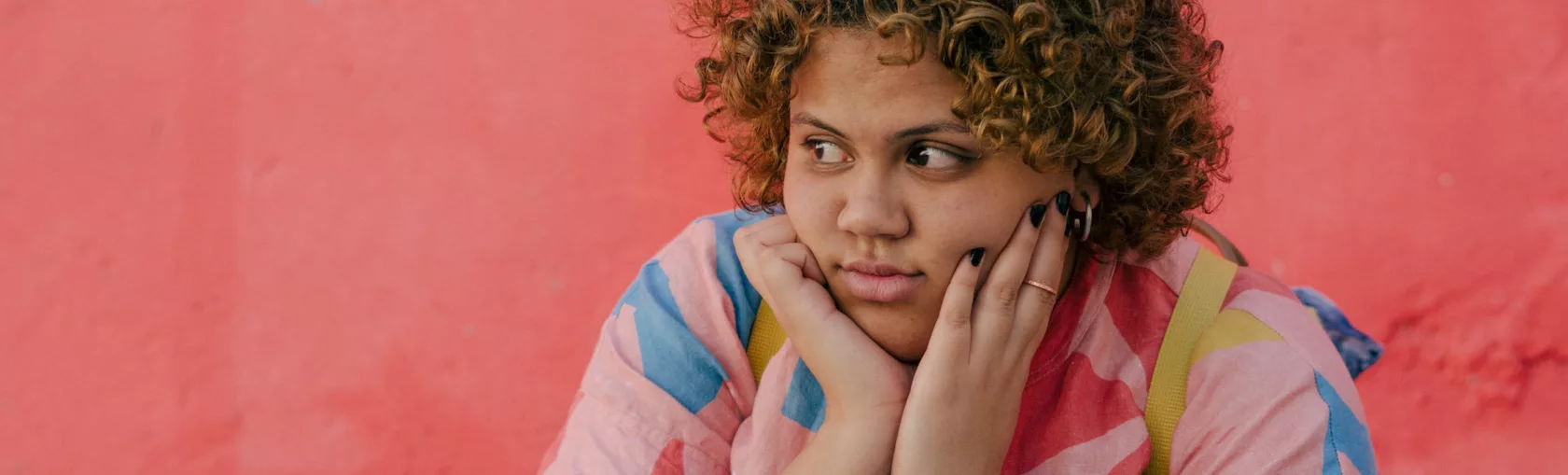 Girl with pink wall
