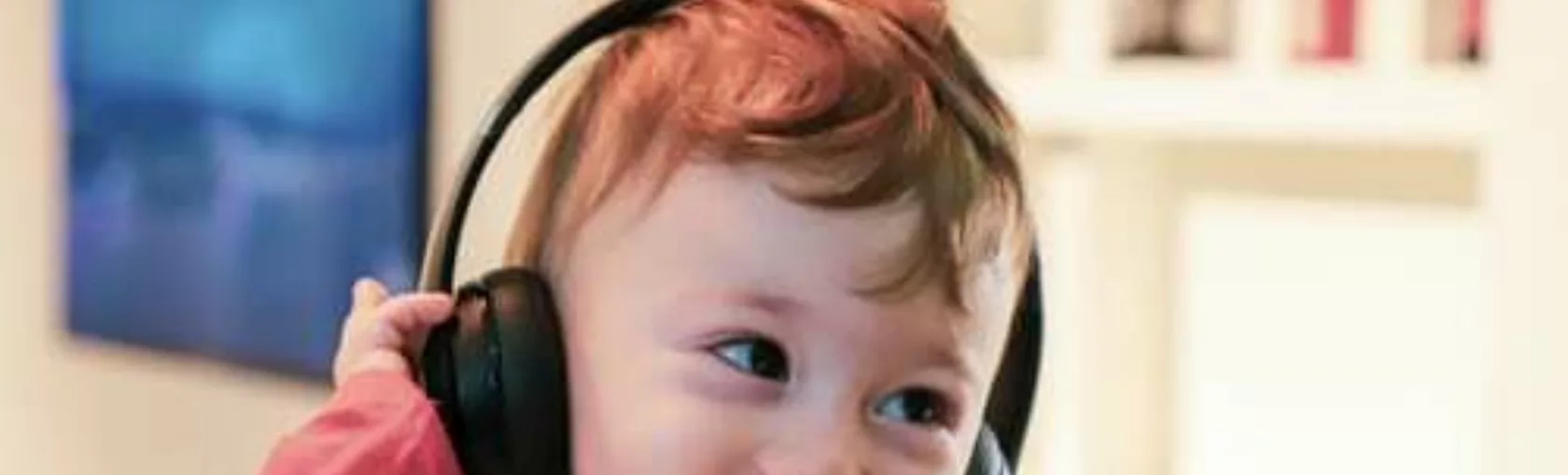 Listening child with earphones