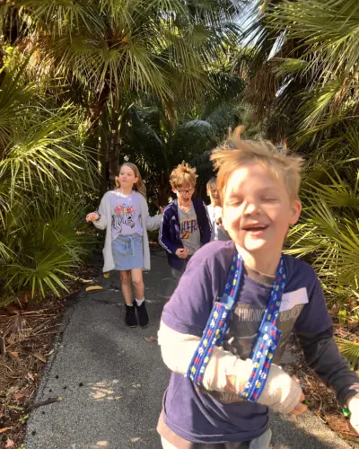 Workshop kids running through trees
