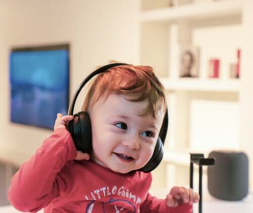 Listening child with earphones